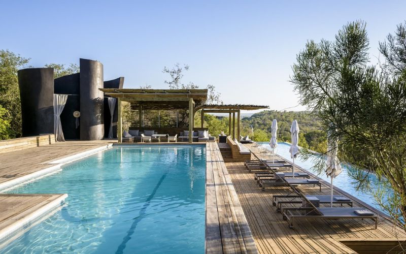 Luxury safari includes down time sitting next to the pool.