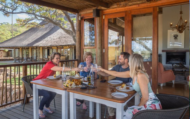 Sian and Vikki of Marula Hill Travel enjoying a luxury safari getaway with friends at Welgevonden Game Reserve, a premier malaria-free safari near Johannesburg.