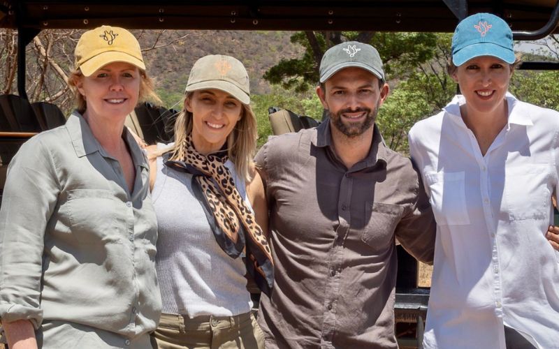 Wearing neutral colours and caps for protection from bugs and the sun on safari.