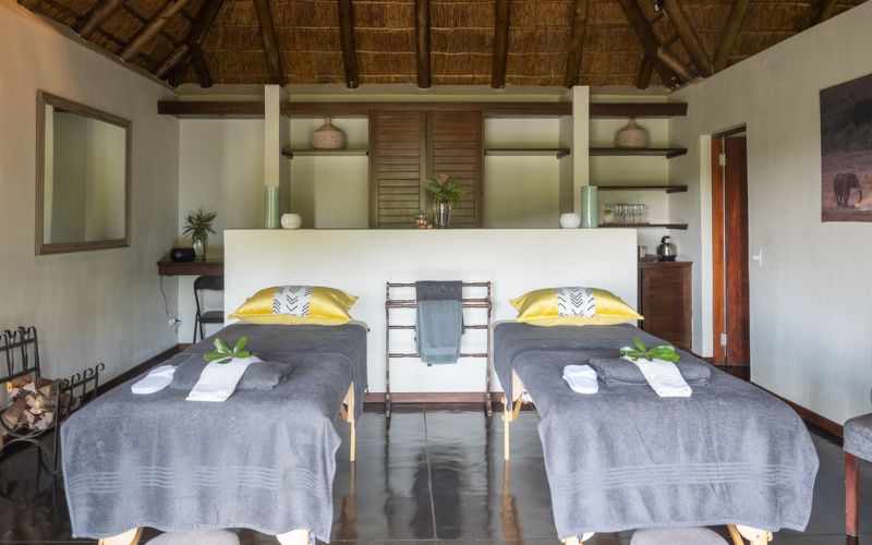 Safari spa retreats- a couples treatment room under thatch.