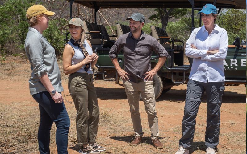 Protective Clothing for Safari.Guests enjoying a stop on a game drive, wearing the right clothes for a safari.