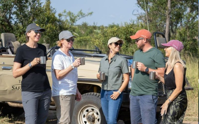 On safari, we are wearing light-weight, neutral-colored clothes and caps for protection against the sun.