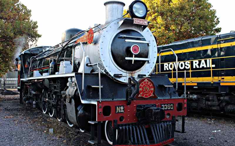 Historic steam locomotive of Rovos Rail parked at the private station, showcasing classic engineering and luxury rail heritage in South Africa.