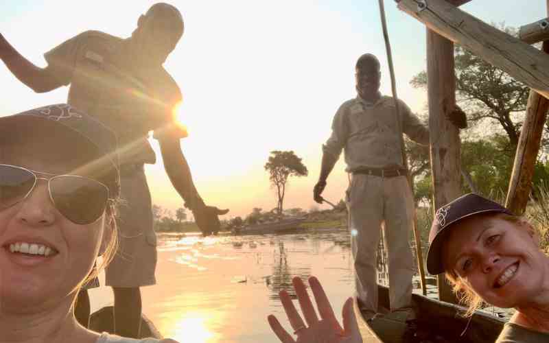 Marula Hill Travel on a mokoro safari, enjoying the sunset on the water.