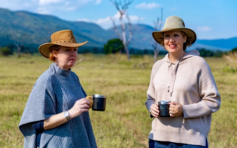 Vikki Jackson and Sian Loehrer enjoying a morning coffee and rusk break on safari in the South African bushveld at Qwabi Private Game Reserve